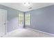Comfortable carpeted bedroom with dual bright windows at 75 Mountainside Ln, Sanford, NC 27332