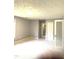 Large bedroom featuring carpet and decorative glass paneled doors at 75 Mountainside Ln, Sanford, NC 27332