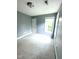 Neutral painted bedroom with plush neutral carpeting, a window, and white trim at 75 Mountainside Ln, Sanford, NC 27332