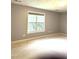 Bedroom featuring carpet, large window, and neutral walls at 75 Mountainside Ln, Sanford, NC 27332