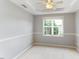 Bright bedroom features neutral paint, carpet, ceiling fan, and a window with a view at 75 Mountainside Ln, Sanford, NC 27332
