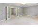 Bonus room with carpet and double doors to another room at 75 Mountainside Ln, Sanford, NC 27332