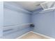 Walk-in closet featuring wire shelving on blue walls at 75 Mountainside Ln, Sanford, NC 27332