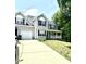A two-story house with a front porch and a two-car garage connected by a driveway at 75 Mountainside Ln, Sanford, NC 27332
