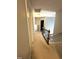 Upstairs hallway featuring carpet, railing and multiple doorways at 75 Mountainside Ln, Sanford, NC 27332