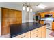 Kitchen view shows large center island, lots of cabinet space, and stainless steel refrigerator and stove at 75 Mountainside Ln, Sanford, NC 27332