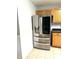 Close up shot of stainless steel refrigerator next to the oak cabinets at 75 Mountainside Ln, Sanford, NC 27332