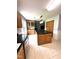 Kitchen with tile flooring, island, and plenty of cabinet space at 75 Mountainside Ln, Sanford, NC 27332