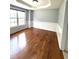 Living room featuring chair-rail molding, hardwood floors, and bright natural light at 75 Mountainside Ln, Sanford, NC 27332
