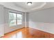 Bright living room with hardwood floors, crown molding, and large window with view to the outside at 75 Mountainside Ln, Sanford, NC 27332
