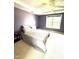 The main bedroom is spacious with carpet floors and large window at 75 Mountainside Ln, Sanford, NC 27332