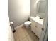 A clean powder room featuring tiled floor and white vanity at 75 Mountainside Ln, Sanford, NC 27332