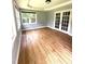 Bright sun room with hardwood floors, large windows, and French doors at 75 Mountainside Ln, Sanford, NC 27332