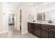 Well-appointed bathroom with double vanity, granite countertops, and a tiled shower area at 808 Buckner Ct, Fuquay Varina, NC 27526