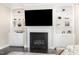 Living room showcasing fireplace with built-in shelving on either side at 808 Buckner Ct, Fuquay Varina, NC 27526