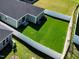A fenced backyard features lush green grass, a modern exterior, and offers a serene outdoor living space at 809 Doggard Ln, Durham, NC 27703