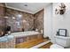 Bathroom showcases a soaking tub, tiled walls, and vanity offering a luxurious bathing experience at 8156 Nc 42 Hwy W, Kenly, NC 27542