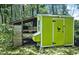 View of a well-maintained chicken coop surrounded by trees, perfect for raising poultry at 8156 Nc 42 Hwy W, Kenly, NC 27542