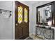 Elegant entryway with a decorative door, ornate mirror, stylish console table, and attractive lighting at 8156 Nc 42 Hwy W, Kenly, NC 27542