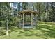 Charming gazebo nestled among trees, offering a tranquil retreat for relaxation and enjoyment at 8156 Nc 42 Hwy W, Kenly, NC 27542