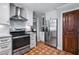 Well-equipped kitchen with stainless steel appliances, white cabinets and granite countertops at 8156 Nc 42 Hwy W, Kenly, NC 27542