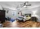 Spacious main bedroom with hardwood floors, ceiling fan, and ample natural light at 8156 Nc 42 Hwy W, Kenly, NC 27542