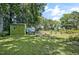 View of a shed and fenced area, perfect for storage and outdoor activities at 8156 Nc 42 Hwy W, Kenly, NC 27542