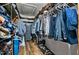 Spacious walk-in closet provides plenty of storage with clothes racks, shelves, and a safe at 8156 Nc 42 Hwy W, Kenly, NC 27542