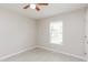 Cozy bedroom featuring tile flooring and a large window providing natural light at 96 Landmark Dr, Angier, NC 27501