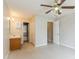 Bright bedroom featuring tile floors, an en suite bathroom, and a ceiling fan at 96 Landmark Dr, Angier, NC 27501