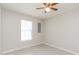 Comfortable bedroom featuring tile flooring and a bright window at 96 Landmark Dr, Angier, NC 27501