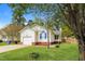 Charming single-story home with a well-manicured lawn, attached garage, and beautiful landscaping at 96 Landmark Dr, Angier, NC 27501