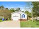Detached one-car garage with driveway and manicured lawn at 96 Landmark Dr, Angier, NC 27501