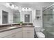 Elegant bathroom features double sinks, granite counters, and a glass-enclosed shower at 100 Culbreth Rd # C, Chapel Hill, NC 27516