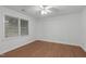 Bright bedroom with a ceiling fan, light-colored walls, and durable flooring at 100 Culbreth Rd # C, Chapel Hill, NC 27516