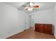 Bedroom with wood flooring, ceiling fan, closet, and traditional wood dresser at 100 Culbreth Rd # C, Chapel Hill, NC 27516