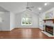 Bright living room featuring vaulted ceilings, a fireplace, ample natural light, and durable flooring at 100 Culbreth Rd # C, Chapel Hill, NC 27516