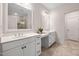 Bright bathroom features double vanity with white countertops, ample storage, and modern finishes at 10310 Sablewood Dr # 111, Raleigh, NC 27617
