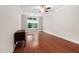 Cozy bedroom with hardwood floors, ceiling fan, and a large window overlooking the backyard at 10310 Sablewood Dr # 111, Raleigh, NC 27617