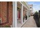 Exterior view of townhomes with covered front porches and landscaped walkway at 10310 Sablewood Dr # 111, Raleigh, NC 27617
