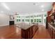 Spacious living area featuring lots of windows, a fireplace, and an open view to the kitchen at 10310 Sablewood Dr # 111, Raleigh, NC 27617