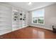 Office with custom built-in shelving and a bright window, offering a functional workspace at 10310 Sablewood Dr # 111, Raleigh, NC 27617