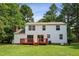 Expansive backyard featuring a wooden deck and a lush lawn, perfect for outdoor enjoyment at 104 Benedict Ln, Raleigh, NC 27614