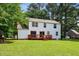 Backyard view of home with deck and green grass at 104 Benedict Ln, Raleigh, NC 27614