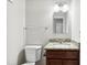 Bathroom with updated granite countertop, classic sink, and white toilet at 104 Benedict Ln, Raleigh, NC 27614