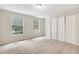 Bedroom with carpet, windows, and closet at 104 Benedict Ln, Raleigh, NC 27614
