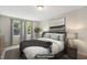 Cozy staged bedroom with neutral tones, featuring a comfortable bed, stylish decor, and natural light at 104 Benedict Ln, Raleigh, NC 27614