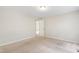 Bedroom with carpet and interior door at 104 Benedict Ln, Raleigh, NC 27614