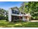 Charming two-story home features a brick facade, blue shutters, and a well-manicured lawn at 104 Benedict Ln, Raleigh, NC 27614