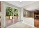 Open kitchen layout featuring sliding glass doors to a wooden deck and seamlessly connected to the living area at 104 Benedict Ln, Raleigh, NC 27614